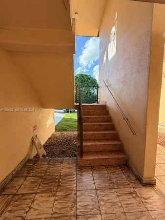 a view of stairs and yard