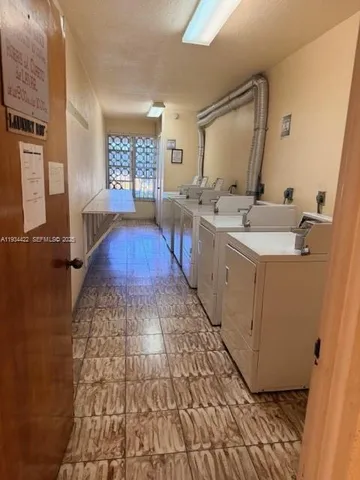 a room with sink and mirror