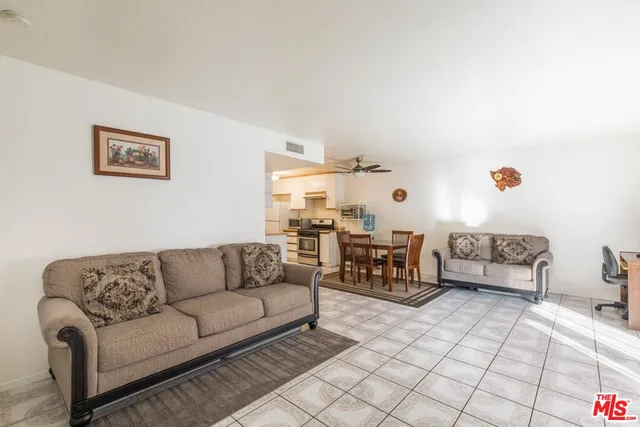 a living room with furniture and a couch