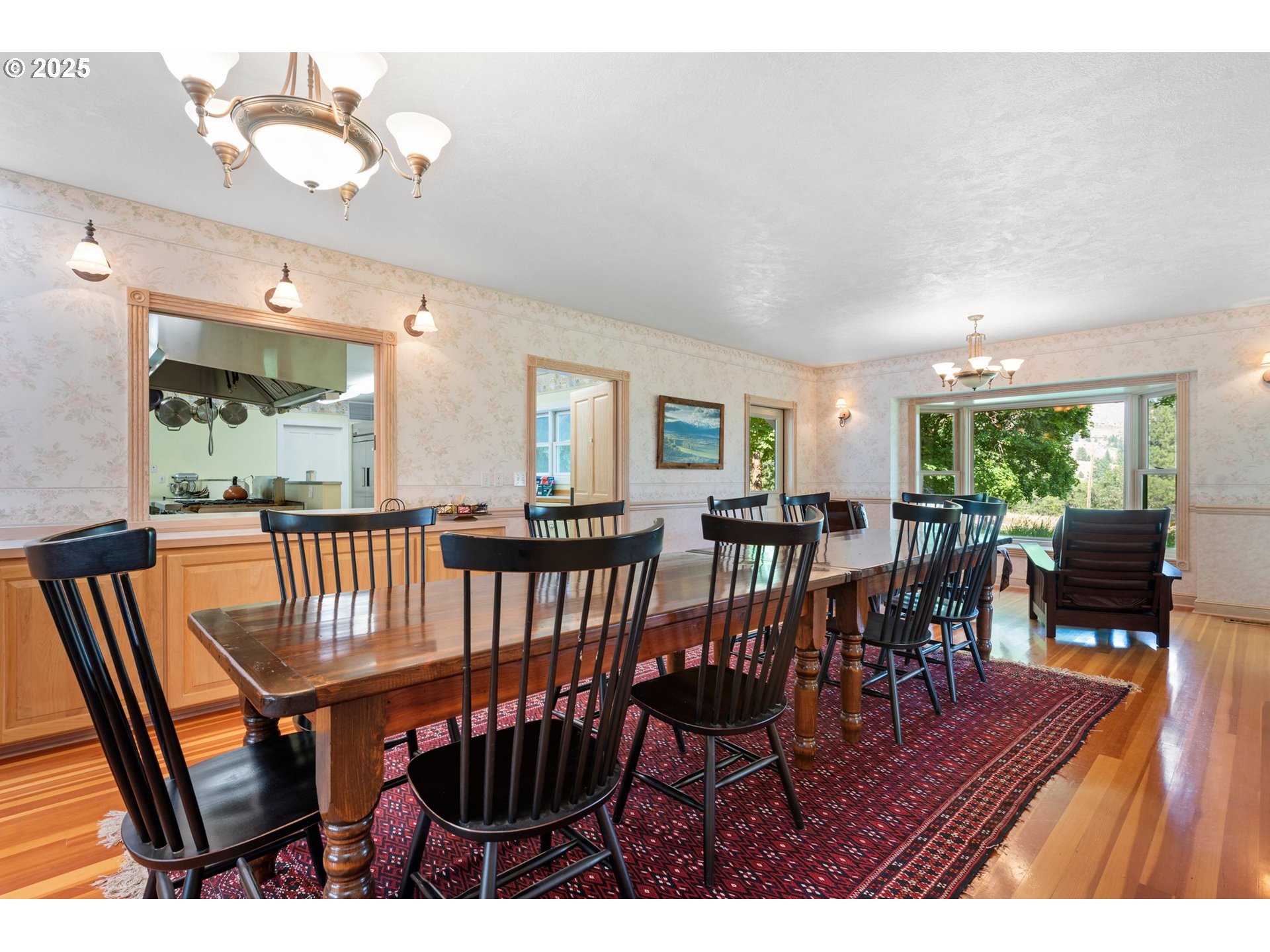 48212 Clear Creek Road Halfway, OR 97834 - Photo 11 of 47 a view of a dining room and livingroom with furniture window and wooden floor