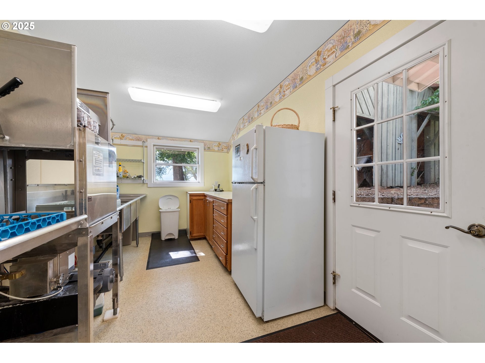 48212 Clear Creek Road Halfway, OR 97834 - Photo 15 of 47 a kitchen with a refrigerator a stove and a sink