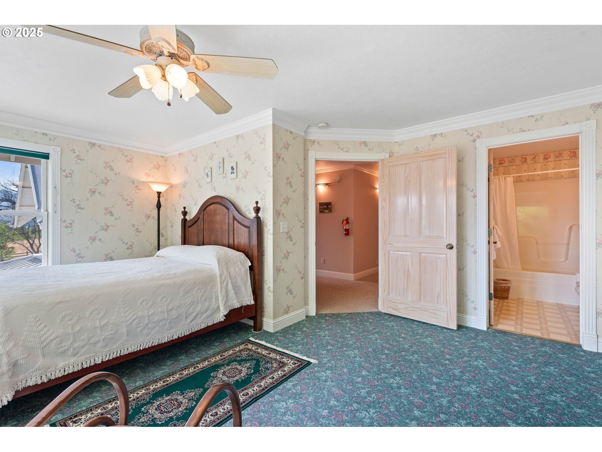 48212 Clear Creek Road Halfway, OR 97834 - Photo 18 of 47 a bedroom with a bed window and a chandelier