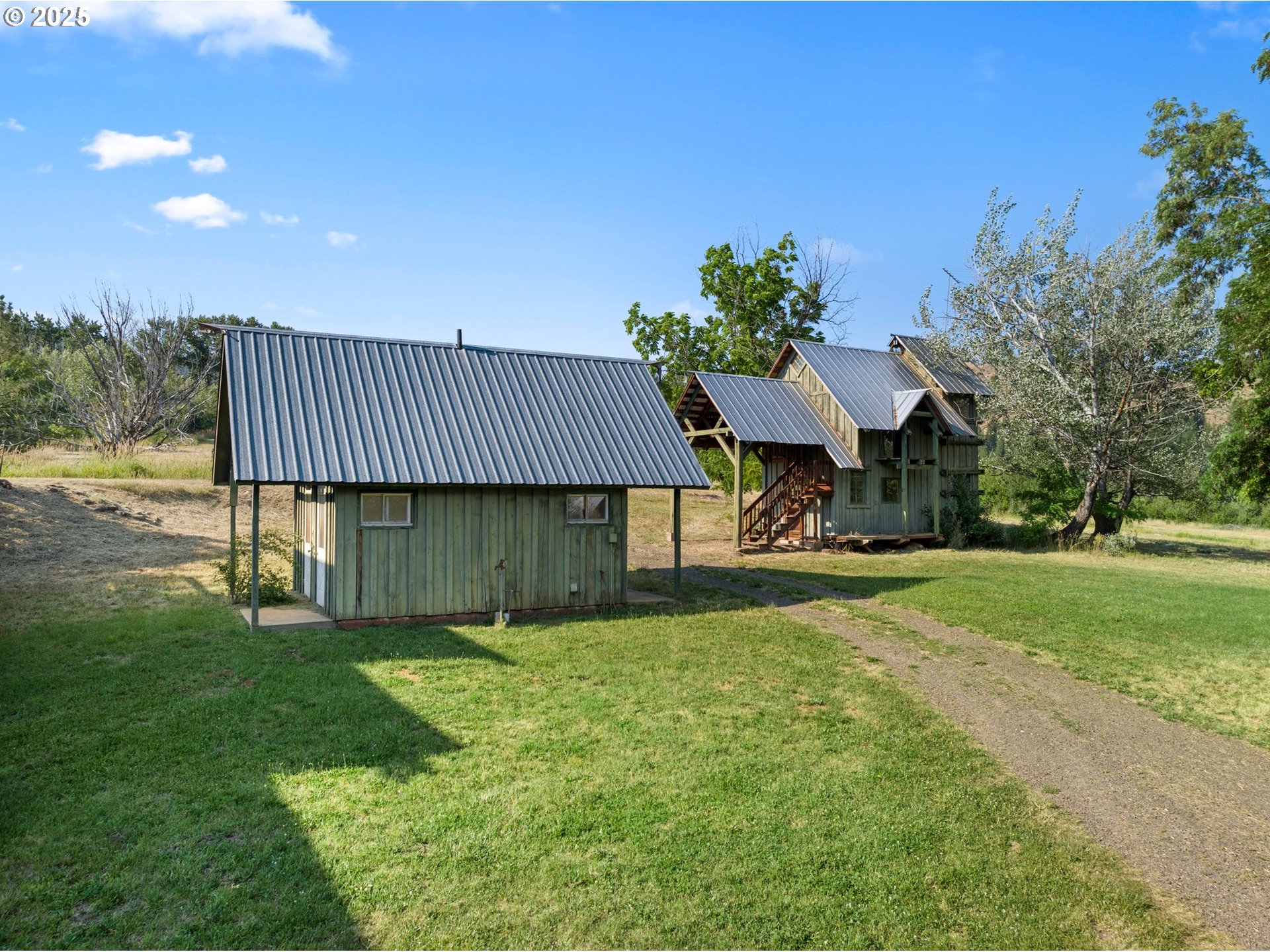 48212 Clear Creek Road Halfway, OR 97834 - Photo 43 of 47 a view of a house with a yard