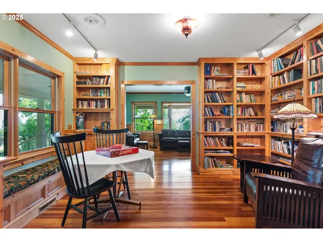 a dining room with furniture and wooden floor