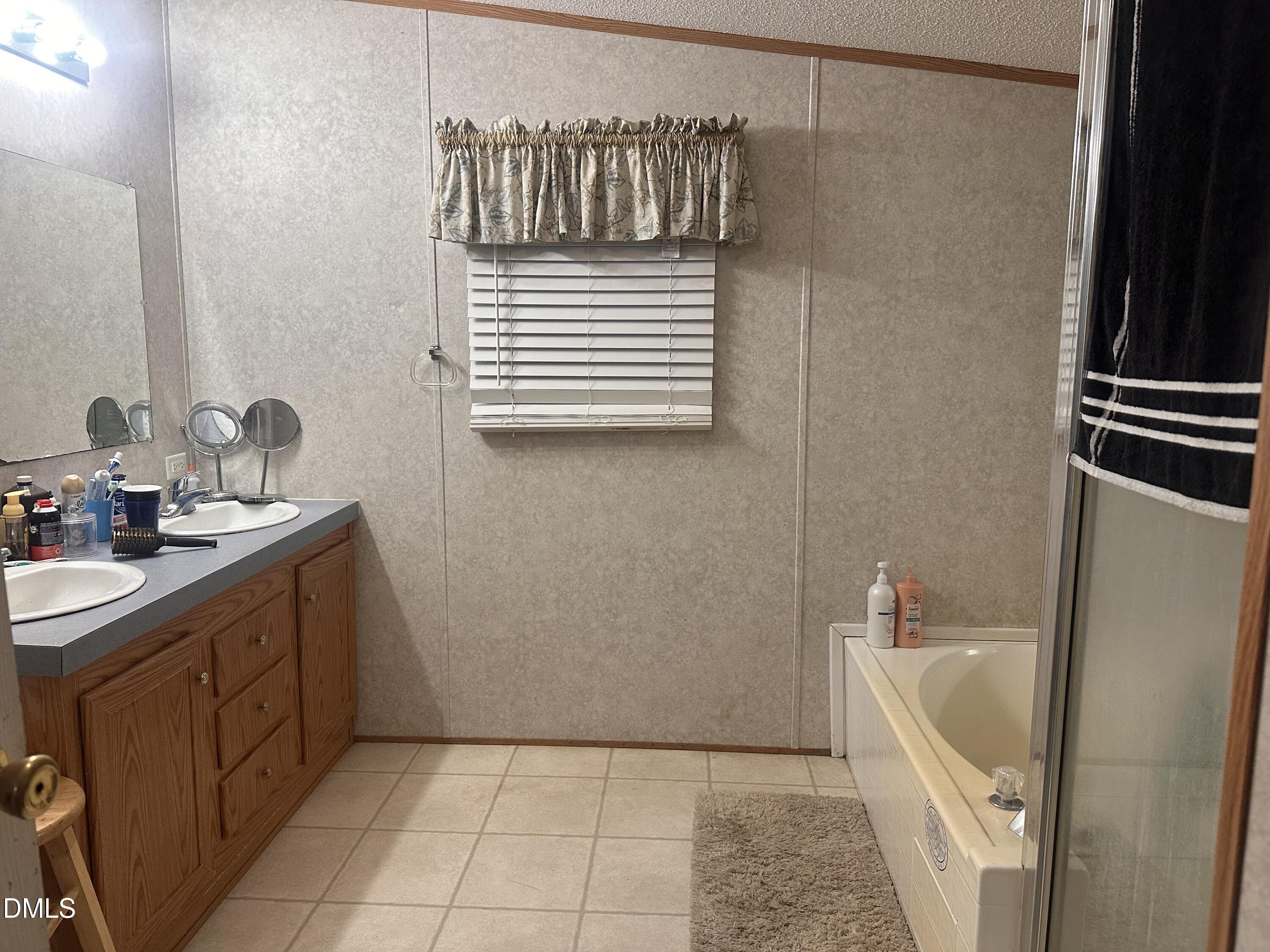 10087 Highway 39 Middlesex, NC 27557 - Photo 17 of 17 a bathroom with a sink a toilet and shower