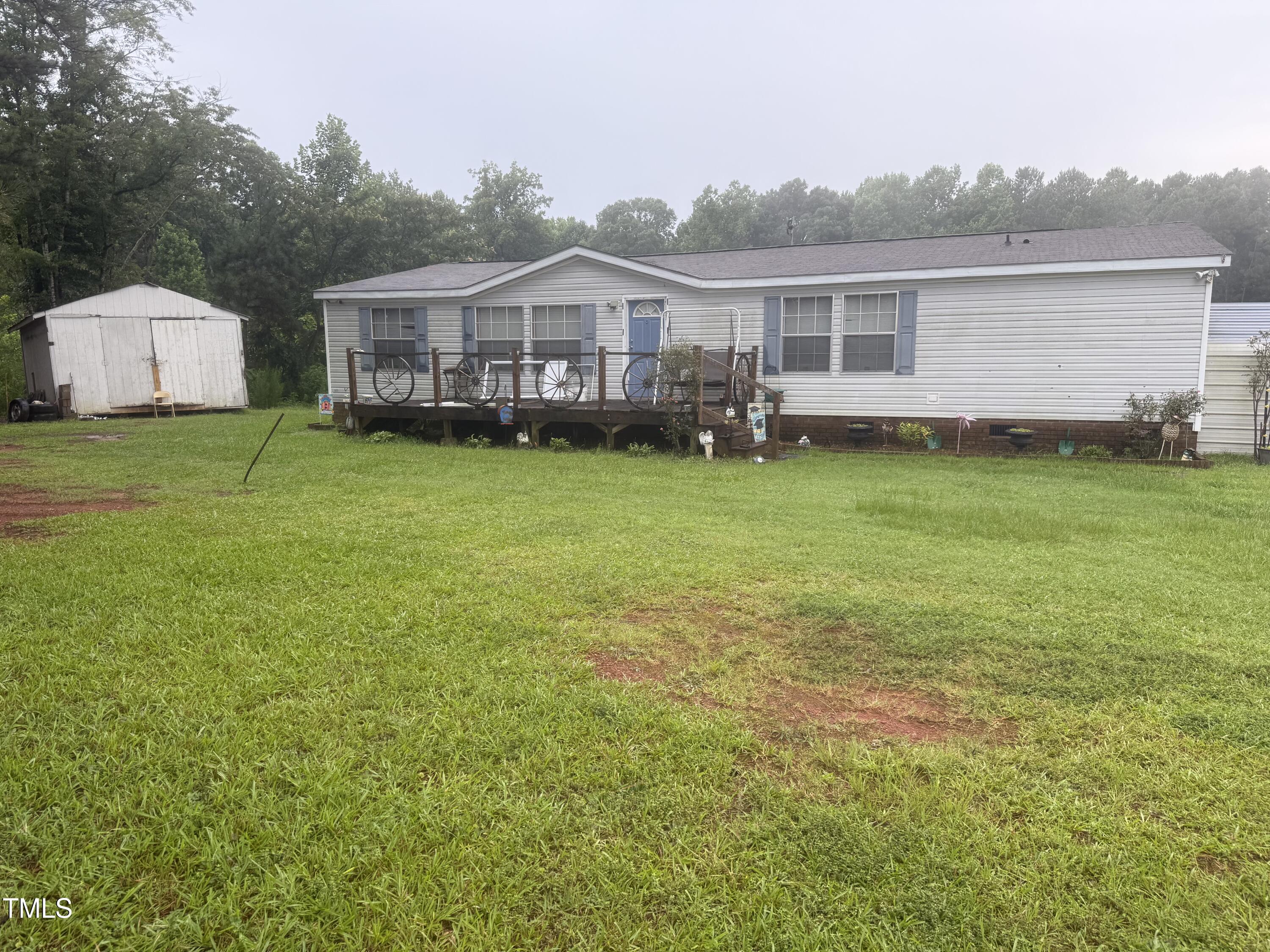 10087 Highway 39 Middlesex, NC 27557 - Photo 2 of 17 a view of a house with a backyard