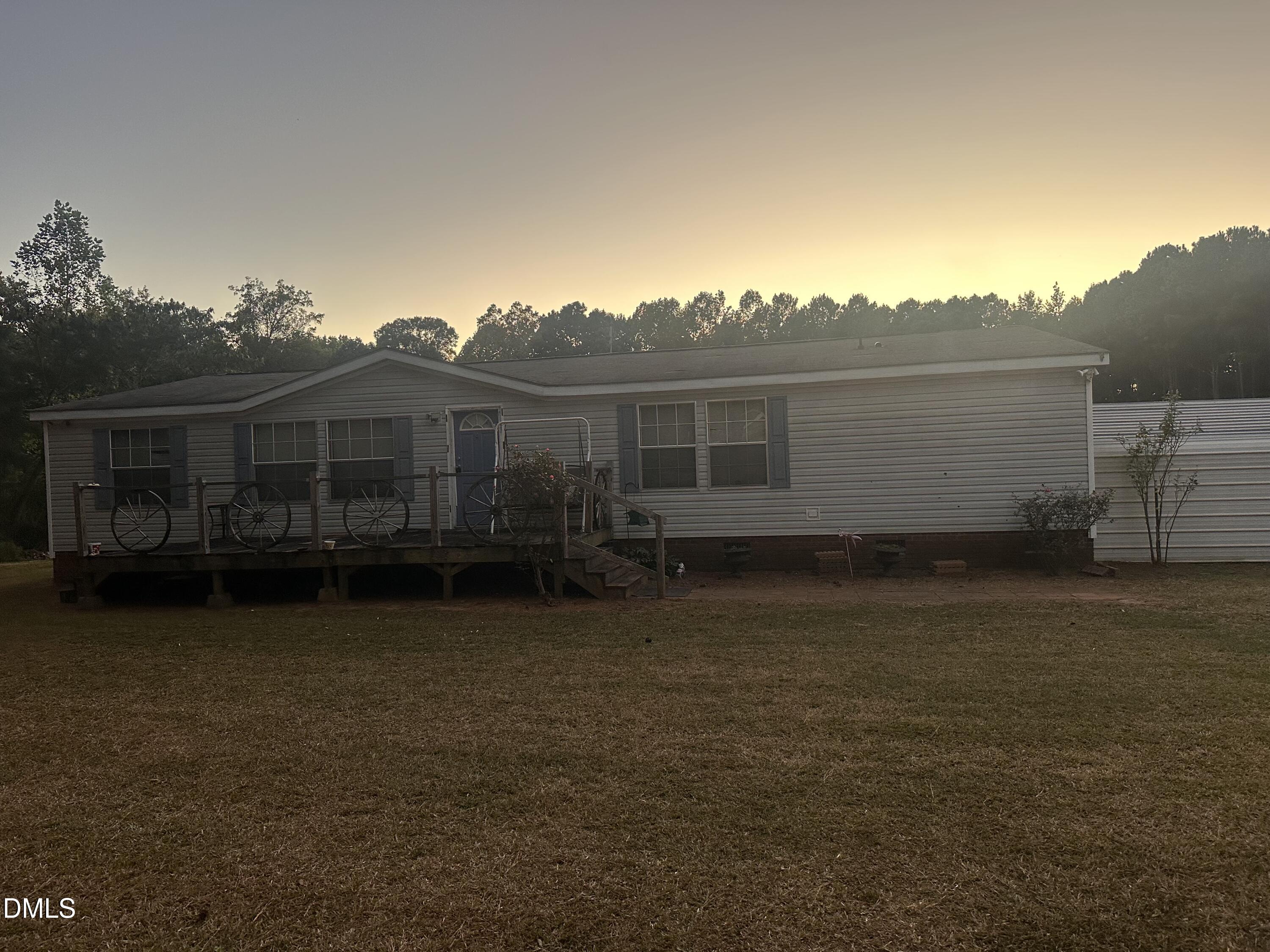 10087 Highway 39 Middlesex, NC 27557 - Photo 8 of 17 a view of a house with a backyard