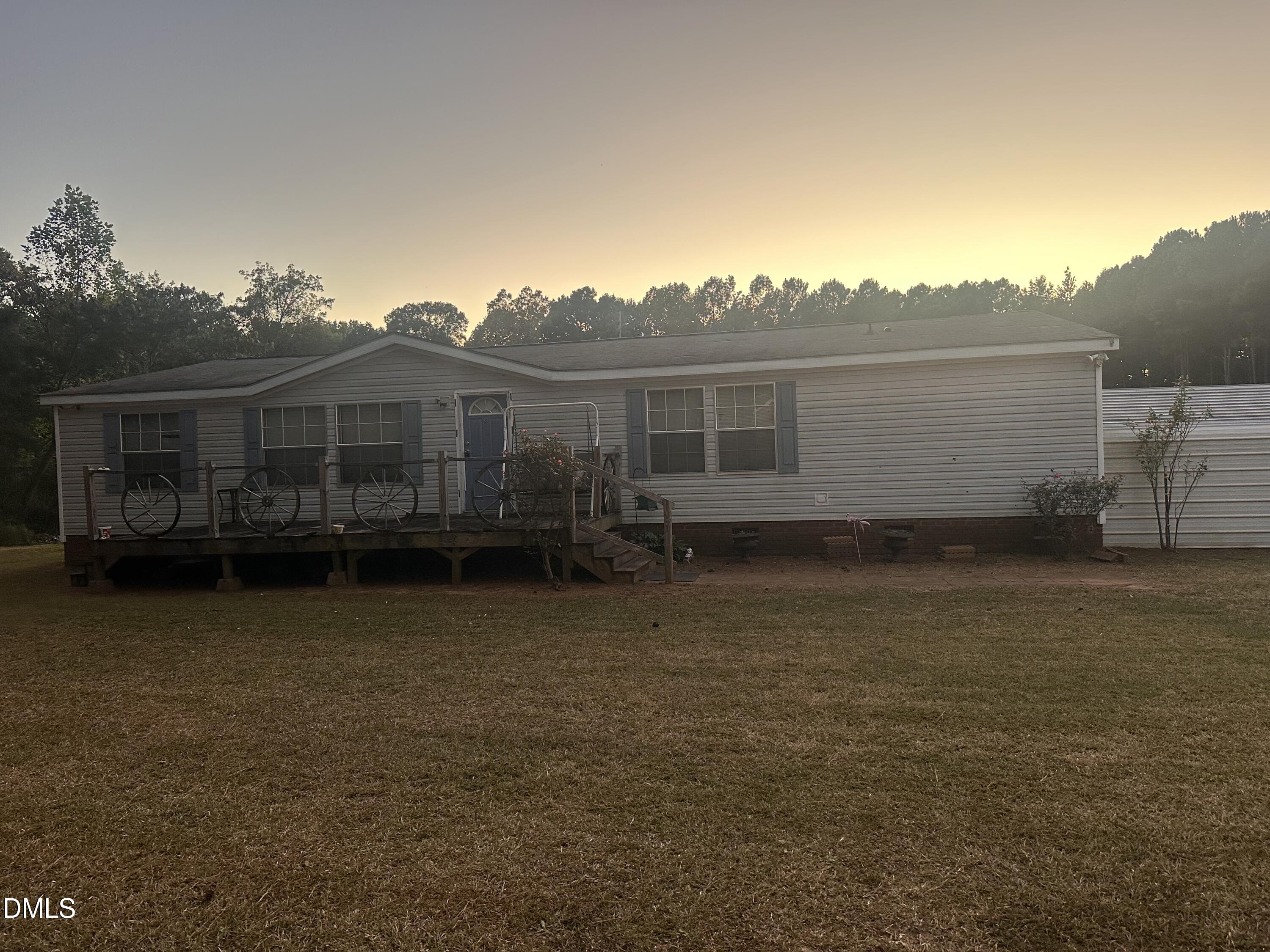10087 Highway 39 Middlesex, NC 27557 - Photo 9 of 17 a view of a house with backyard and garden