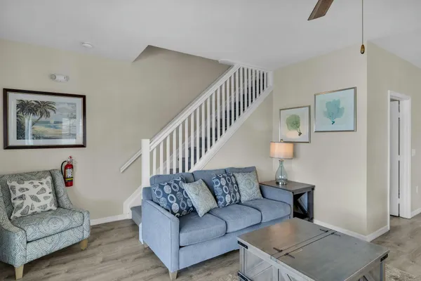 a view of a porch with furniture and garden