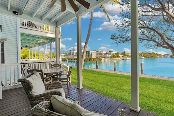 a view of a backyard with a garden and seating area