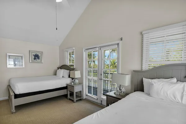 a view of a deck with barbeque grill and plants