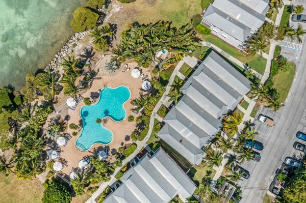a bathroom with a shower a sink and toilet
