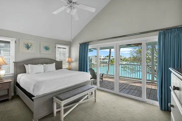 a bed room with a bed and a television