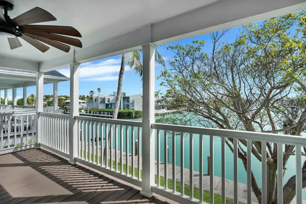 a view of a balcony with chairs