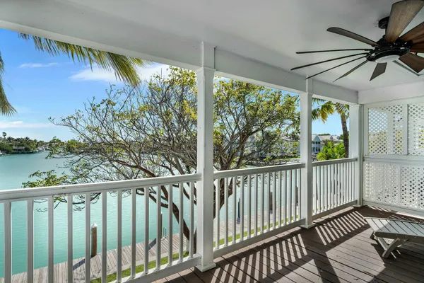 a bed room with a bed and a chandelier