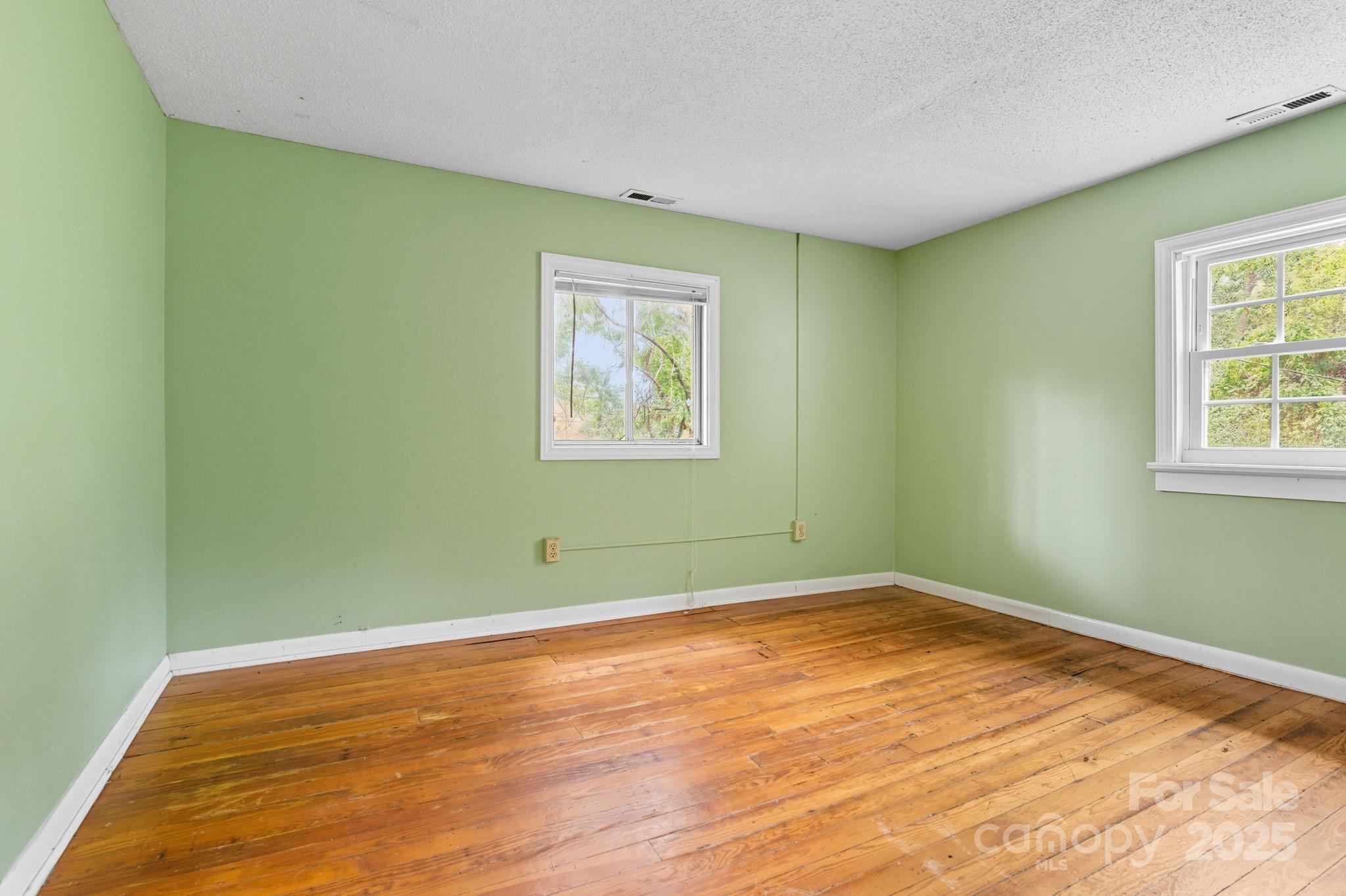 132 Little Knob Road Asheville, NC 28803 - Photo 12 of 18 a view of a room with wooden floor and window