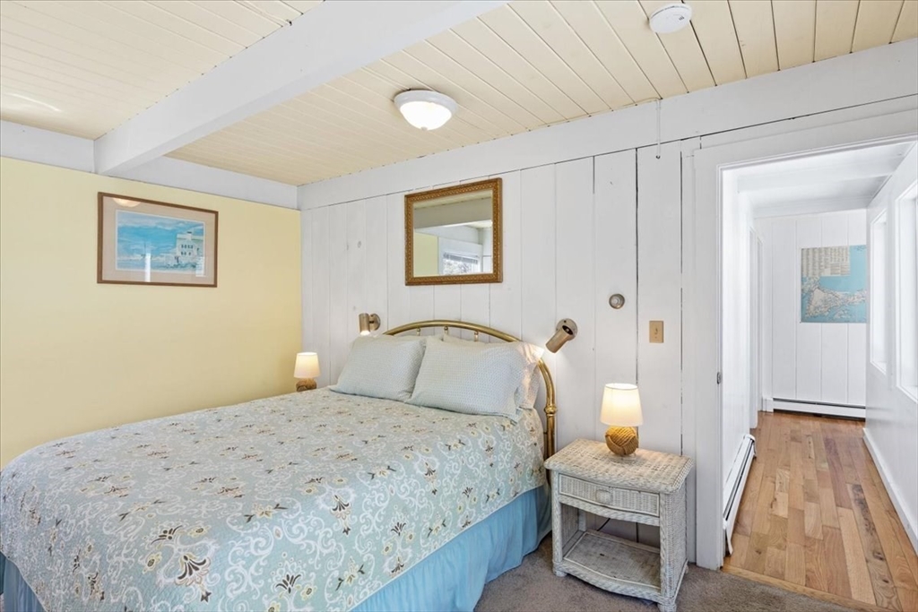 35 Tecumseh Road Wellfleet, MA 02667 - Photo 12 of 24 a bedroom with a bed and a view of painting
