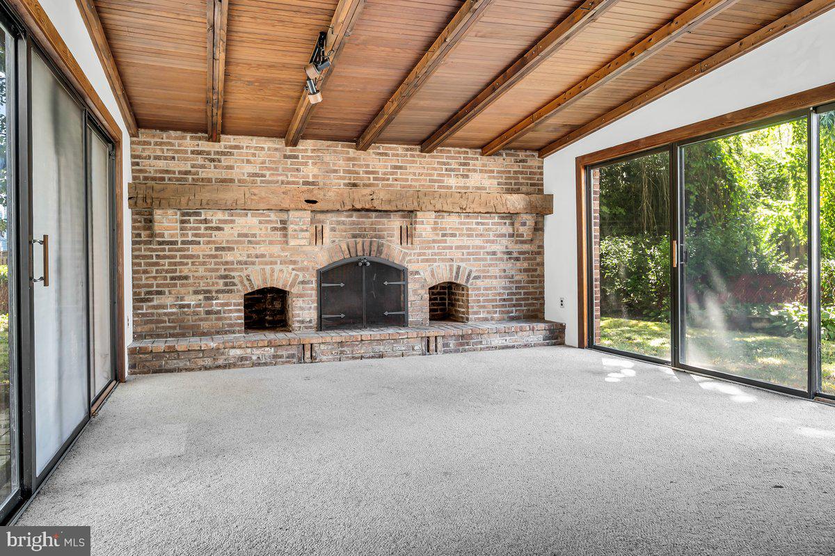 1216 Grayrock Road Newark, DE 19713 - Photo 14 of 28 a view of livingroom with fireplace and outdoor view