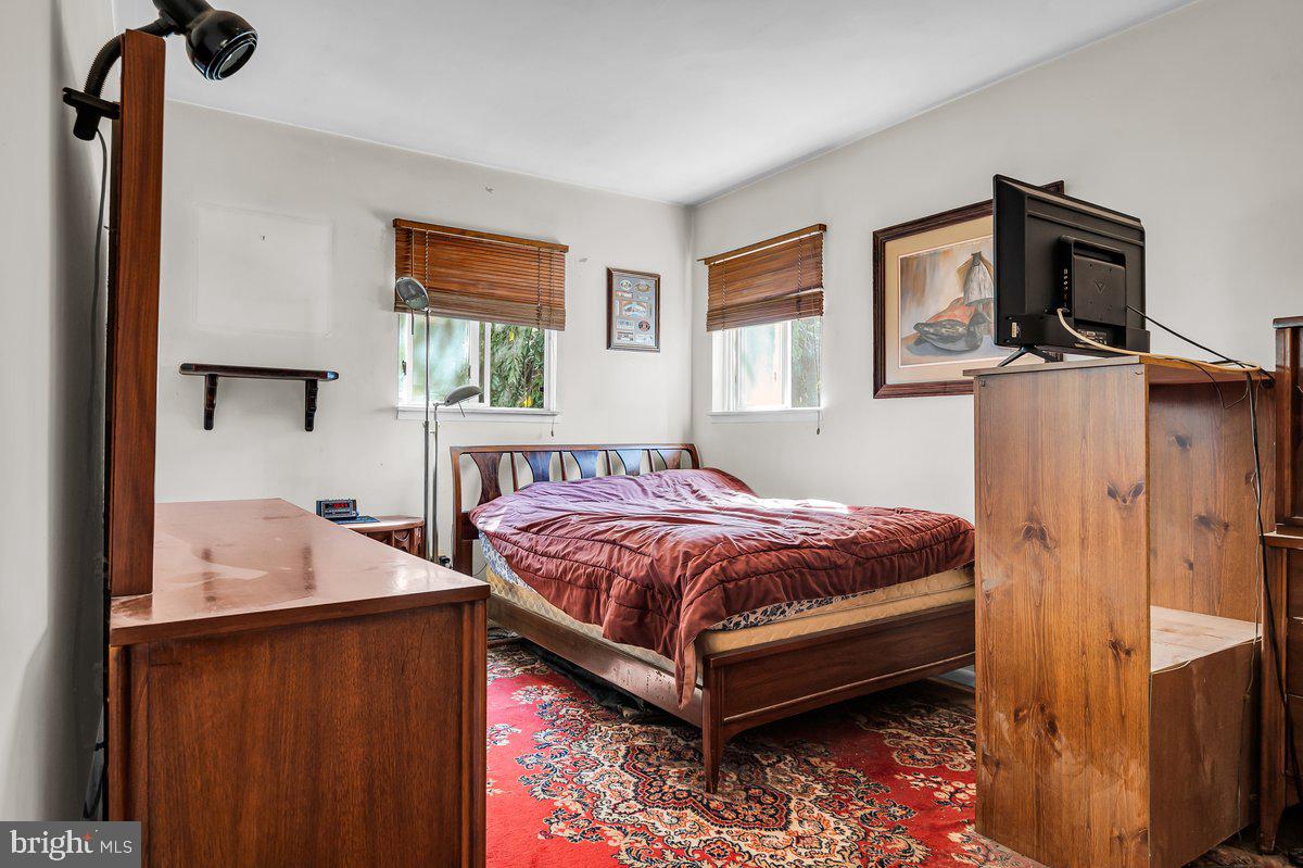 1216 Grayrock Road Newark, DE 19713 - Photo 18 of 28 a bedroom with a bed dresser and a window