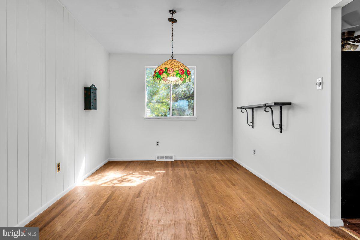 1216 Grayrock Road Newark, DE 19713 - Photo 8 of 28 wooden floor in an empty room with a window