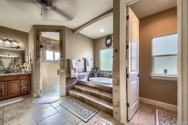 a view of a hallway with living room and dining room
