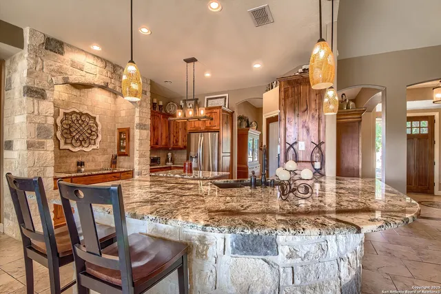 a kitchen with a table and chairs in it