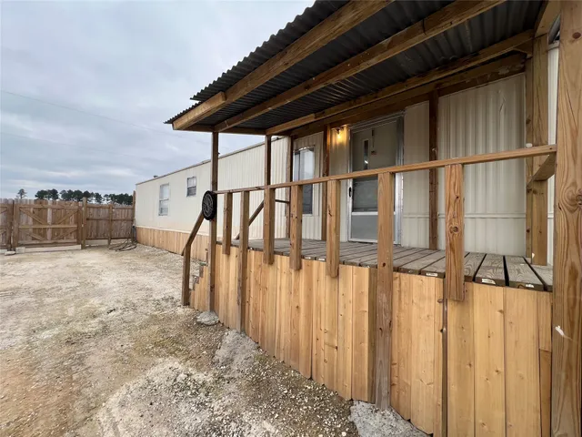 a view of staircase with wooden floor and fence