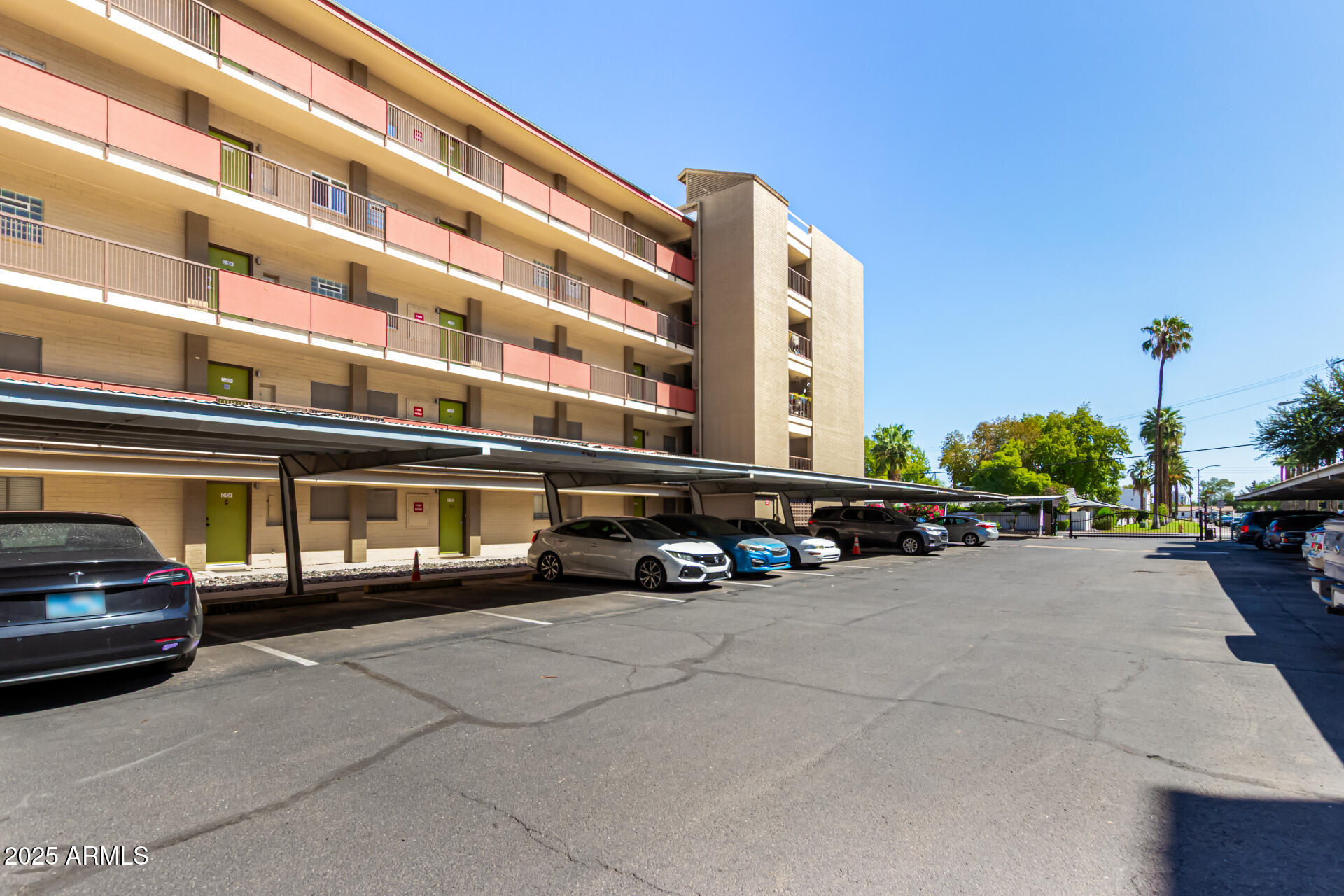 351 East Thomas Road, Unit D505 Phoenix, AZ 85012 - Photo 26 of 28 a view of a car is parked in front of a building