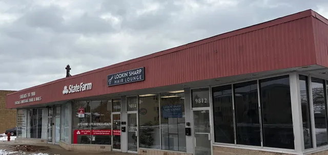 a front view of a building with retail shops