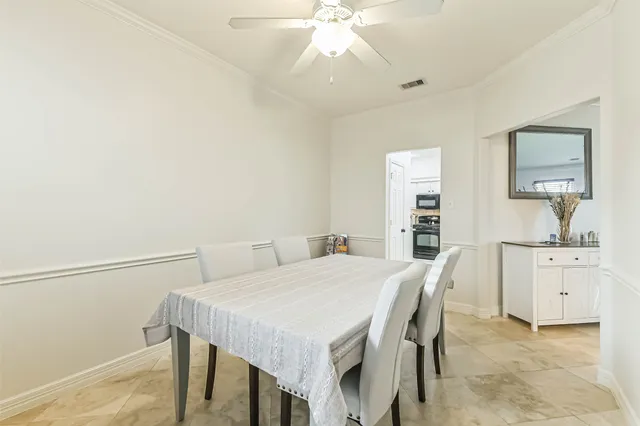 a bathroom with a double vanity sink mirror and bathtub