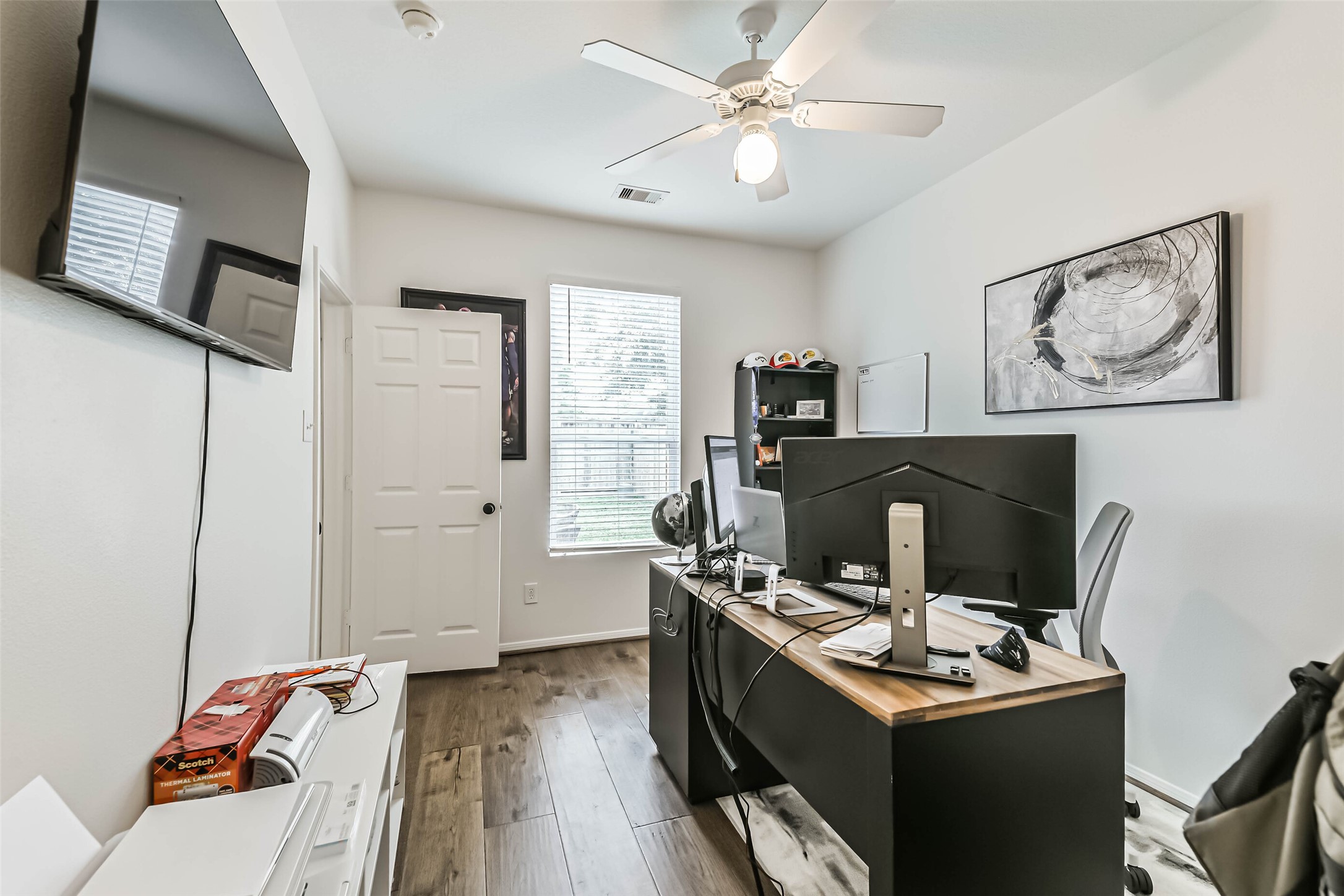 22538 Goss Spring Court Spring, TX 77373 - Photo 19 of 36 a view of a workspace with furniture and a window