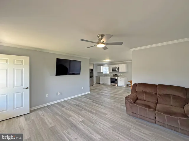 a backyard of a house with a table and chairs