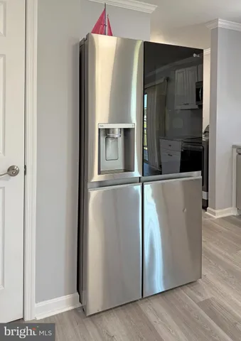 a kitchen with stainless steel appliances a refrigerator stove and sink