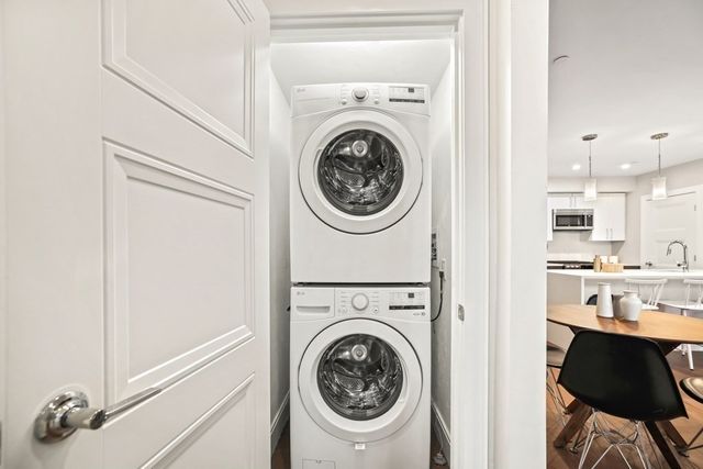 a view of a kitchen with washer and dryer