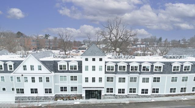 a view of a large building with a street