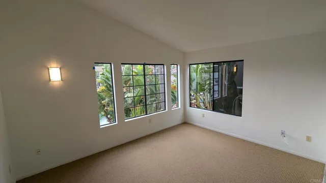 a spacious bathroom with a double vanity sink a mirror and a toilet
