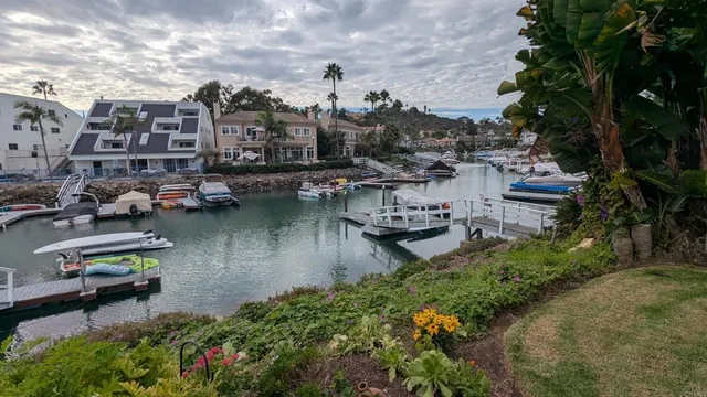 a bedroom with wooden floor and a window