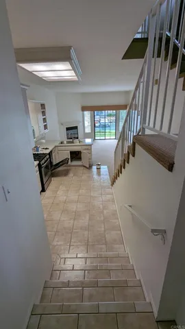 a living room with a flat screen tv and a fireplace