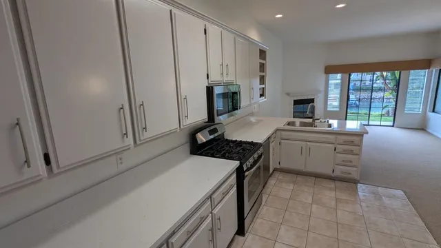 a view of staircase with wooden floor and white walls