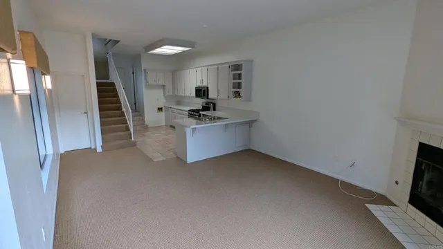 a view of a room that has a large window