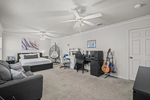 a view of a livingroom with furniture and a ceiling fan
