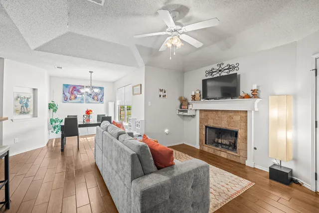 a living room with furniture and a fireplace