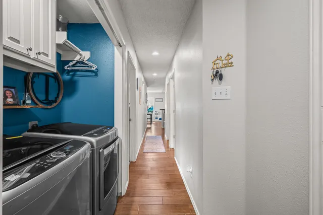 a view of hallway with washer and dryer