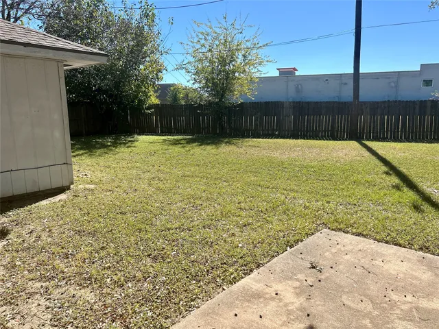 a swimming pool that is in the backyard of a house
