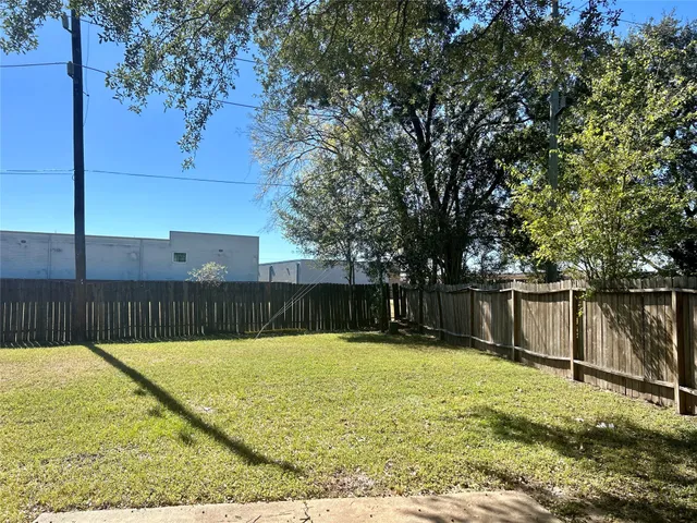a swimming pool with wooden fence