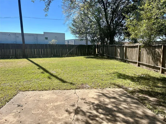 a bath tub sitting next to a white toilet