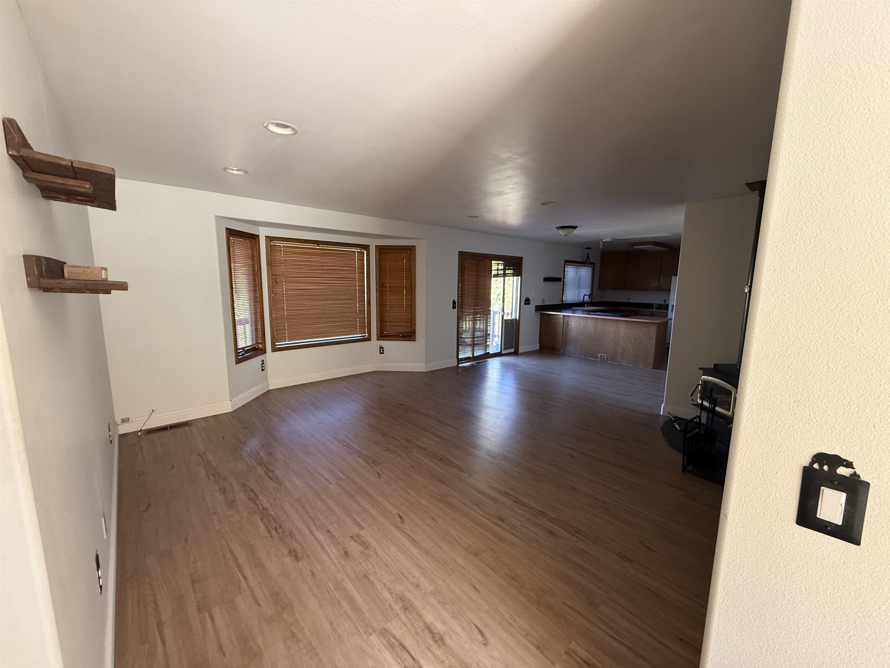 35 Potato Peak Road Bridgeport, CA 93517 - Photo 11 of 21 a view of empty room with wooden floor and windows