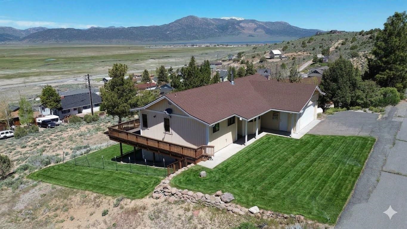 35 Potato Peak Road Bridgeport, CA 93517 - Photo 2 of 21 a view of a house with a yard and a mountain