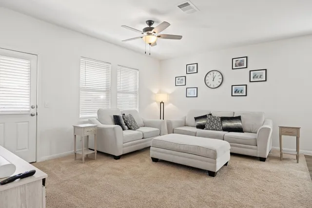 a living room with furniture and window