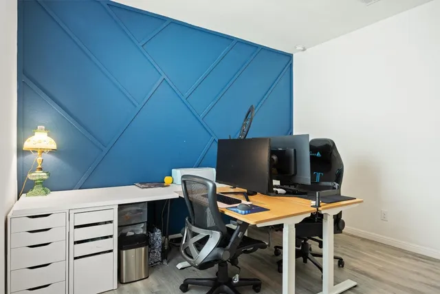 a workspace with furniture and wooden floor